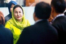 Wife of ex-Malaysian leader charged with money laundering