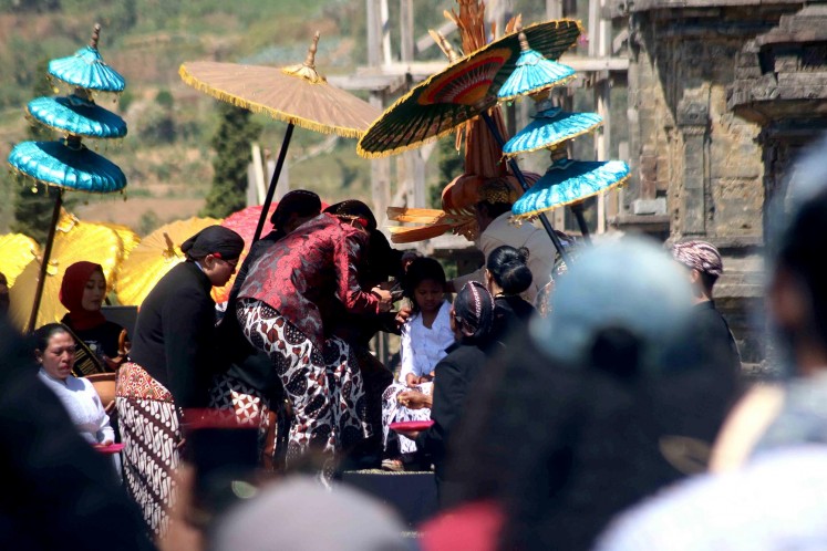 Haircutting ritual in Dieng Plateau