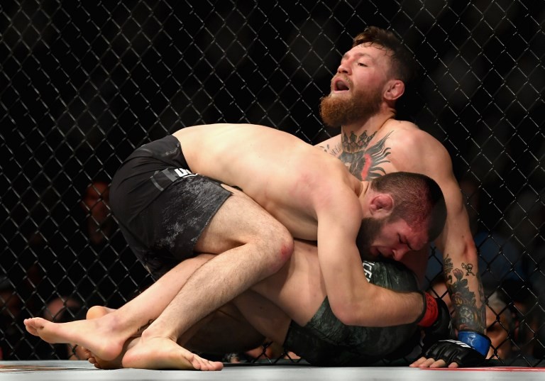 Khabib Nurmagomedov of Russia holds down Conor McGregor of Ireland in their UFC lightweight championship bout during the UFC 229 event inside T-Mobile Arena on October 6, 2018 in Las Vegas, Nevada.
