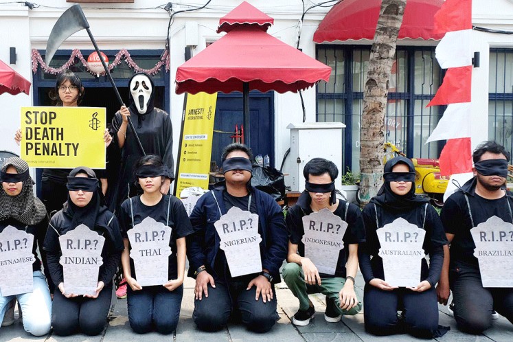 Human rights activists stage a rally in Kota Tua, West Jakarta, in this file photo to commemorate World Day against the Death Penalty. 