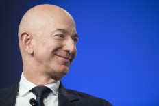 Bezos accuses Enquirer of 'blackmail' over intimate photos