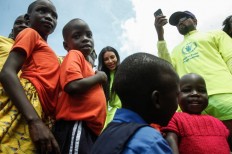 Kanye West gives Ugandan children Yeezys during visit