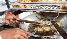 A street food vendor uses used cooking oil to fry fish in Jakarta on Oct. 30, 2018.
