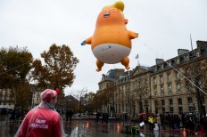 Topless protesters held in bid to 'welcome' Trump to Paris