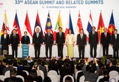 Trade ministers of ASEAN member countries pose for photograph signing an agreement on the ASEAN Agreement on E-Commerce in Singapore on Nov. 12, 2021.