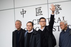 Hong Kong democracy leaders go on trial over Umbrella Movement
