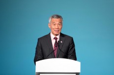 Two Singapore ruling party lawmakers quit in rare political drama