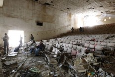 To reclaim Baghdad, Iraqi artists grapple with its ghosts