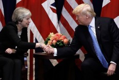 Trump trips up May as she bids to sell Brexit deal
