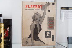 In this file photo taken on November 26, 2018 late Playboy publisher Hugh Hefner's personal copy of the first Playboy issue featuring Marilyn Monroe is displayed as part of Julien's Auctions upcoming sale of his belongings in Beverly Hills, California.