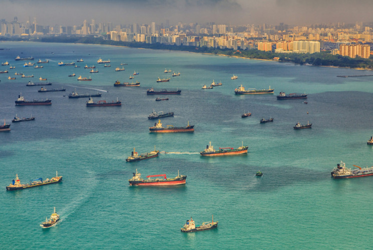 Cargo ships sail in the Malacca Strait between the Malay Peninsula and Sumatra in this undated photograph, a strait that remains vulnerable to drug smuggling increasingly foiled by authorities.