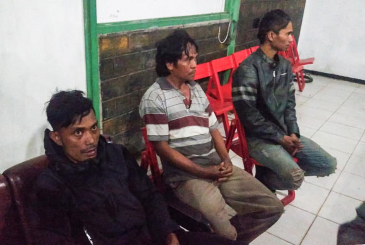 In this picture taken and release on December 5, 2018 by Indonesian military shows alleged survivors in Wamena, Papua province, of an alleged killing in Nduga a day before. - Indonesian soldiers hunted for rebels suspected of killing a group of construction workers in restive Papua province, the military said, as they supplied one survivor's account of a grisly mass execution.