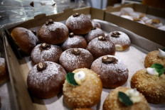 Hanukkah doughnuts, called 'sufganiyot' in Hebrew, are seen for sale at a market in Jerusalem on December 6, 2018.