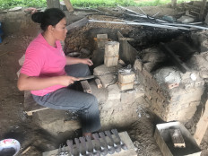Turning bombs into bracelets, as Laos villagers wait for safe land