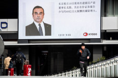 Ex-Nissan chief Ghosn charged, served with fresh arrest warrant