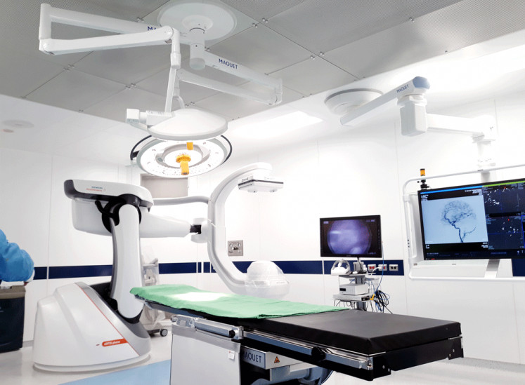 Less cutting, more technology: A hybrid operating room for neurosurgery at Tri-Service General Hospital in Taipei, Taiwan. Advanced medical imaging devices in the room enable the doctors to carry out minimally invasive surgery.