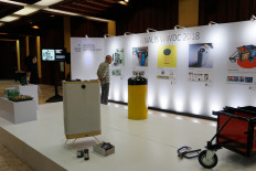 Visitors read explanations about the creations made by the five finalists of the 2018 Waste Wise Design Competition on Wednesday, Dec. 12 at Manggala Wanabakti in Central Jakarta. 