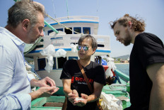 Cuong Pham introduces guests to special salt from the port city of Vung Tau during a Nov. 2 site visit. 