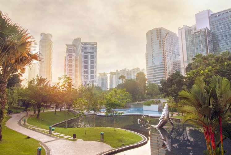 A peaceful scene at KLCC park in the Petronas Twin towers vicinity in the morning calm where visitors have not arrived.