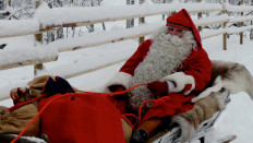 A man dressed as Santa Claus rides his sleigh near the Santa Claus Office located on the Arctic Circle near Rovaniemi, Finland, on Dec. 13, 2018