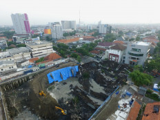 'I thought it was an earthquake': Giant sinkhole opens on busy Surabaya road
