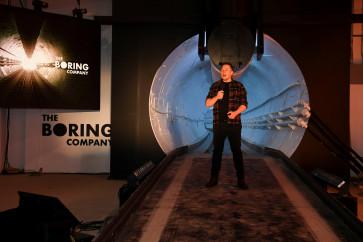 Tesla Inc. founder Elon Musk speaks at the unveiling event by 'The Boring Company' for the test tunnel of a proposed underground transportation network across Los Angeles County, in Hawthorne, California, U.S. December 18, 2018. 