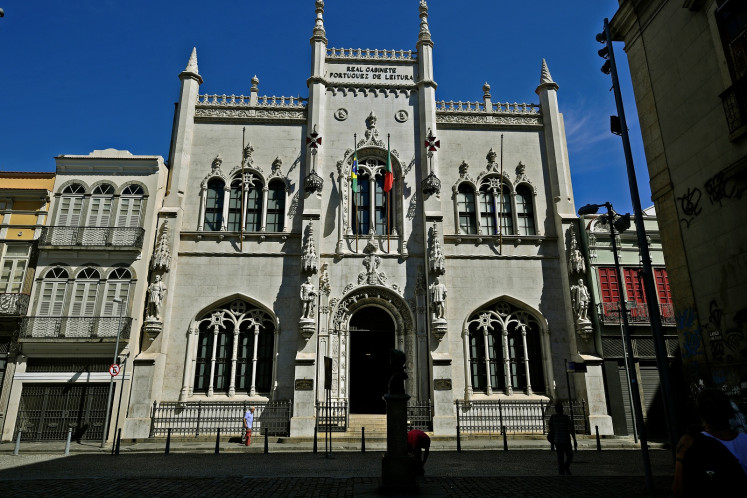 View of the facade of the Royal Portuguese Cabinet of Reading in Rio de Janeiro, Brazil on December 5, 2018. From the outside, it looks like another historic edifice in Rio's rundown city center. Inside, however, is a multi-tiered library so spectacular, so ornate, that stunned visitors feel like they've walked into a movie fantasy set.