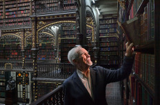 Brazilian Architect and researcher Carlos Francisico Moura, is seen at the Royal Portuguese Cabinet of Reading in Rio de Janeiro, Brazil on December 5, 2018. From the outside, it looks like another historic edifice in Rio's rundown city center. Inside, however, is a multi-tiered library so spectacular, so ornate, that stunned visitors feel like they've walked into a movie fantasy set.