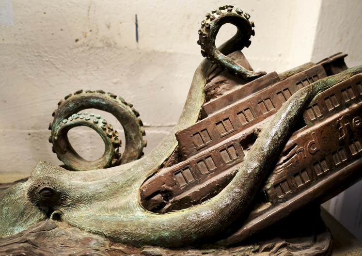In this file photo taken on December 18, 2018 a detail of a sculpture by artist Joseph Reginella at his Staten Island studio, New York, depicts the Staten Island Ferry Octopus Disaster of 1963, during which one of the borough's famous orange boats was dragged below the East River's surface by an enormous, tentacled beast. 