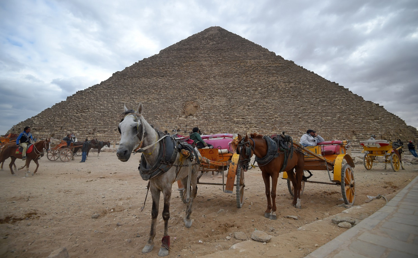 Tourists throng Egypt pyramids after bombing, but future          clouded