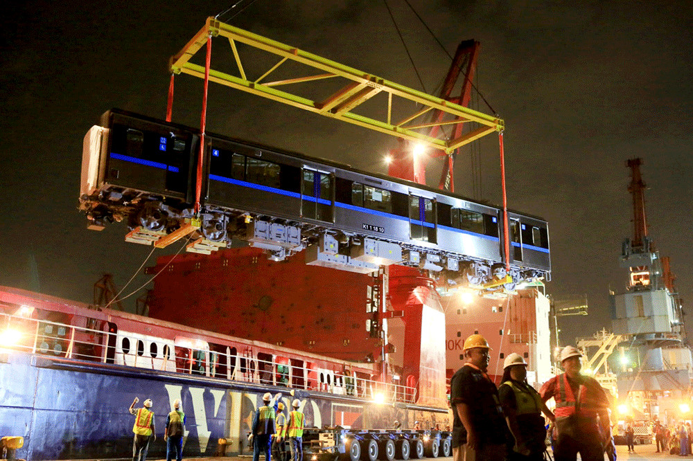 Workers unload MRT cars from a ship in Tanjung Priok Port, North Jakarta, on April 4, 2018. 