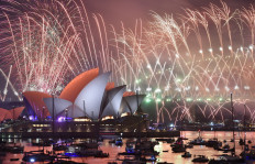 New Year's Eve fireworks erupt over Sydney's iconic Harbour Bridge and Opera House during the fireworks show on January 1, 2019. 