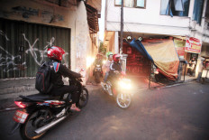 In Jakarta, kampungs coexist with skyscrapers