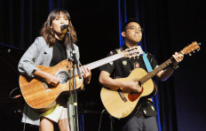 The flowers blooming from a pungent pot of dirt