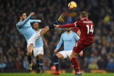 Man City snap Liverpool's unbeaten run to reignite title race