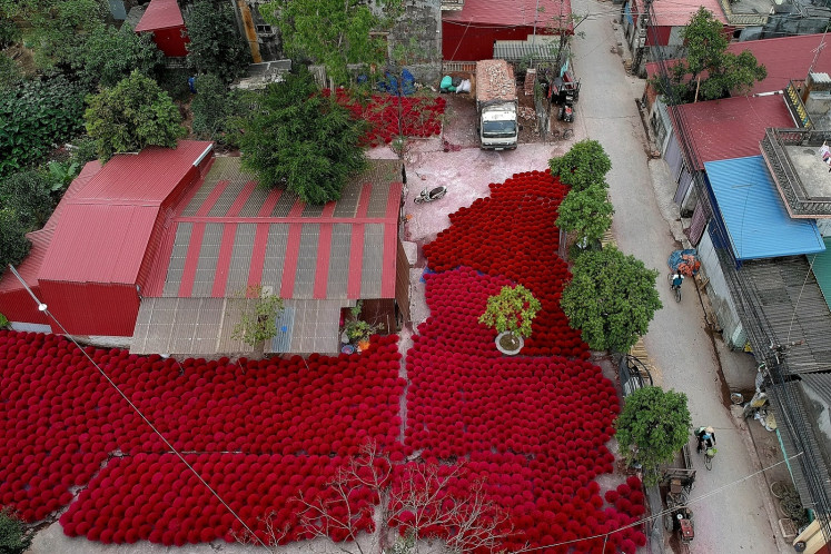 This aerial picture taken on January 4, 2019 shows incense sticks kept in a courtyard for drying in the village of Quang Phu Cau on the outskirts of Hanoi. 