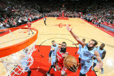 Jumping for glory: James Harden (13) of the Houston Rockets drives to the basket as Joakim Noah (55) of the Memphis Grizzlies tries to defend during their game on Monday at the Toyota Center in Houston, Texas. 