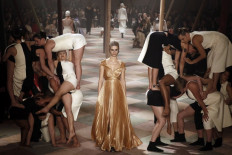 Fashion rolls up for Dior's chic strongwoman circus