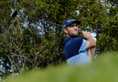 Rahm seizes early lead at Farmers, Woods opens with 70