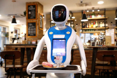 Robots serve up food and fun in Budapest cafe