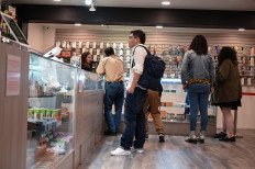 Cannabis tourists browse products in a marijuana dispensary on a cannabis tour organized by LA-based Green Tours, January 24, 2019 in Los Angeles, California. 