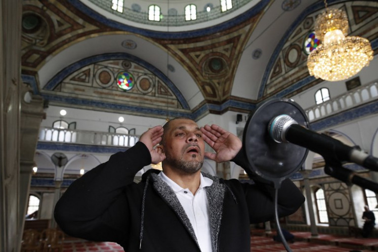 Arab Israeli bodybuilder and Muezzin Ibrahim Masri, calls to prayer at el-Jazzar mosque in the northern Israeli port city of Acre on January 29, 2019. Masri has been calling Muslims to prayer for nearly 15 years in Acre, but that sound will stop, after he was fired for taking part in a body building competition.