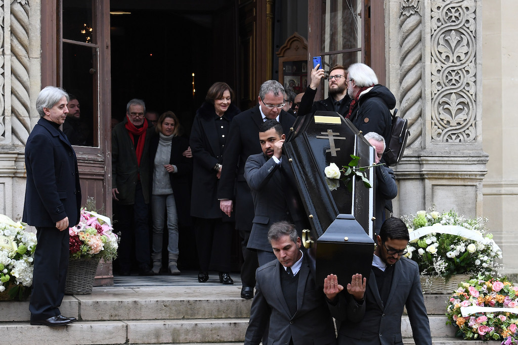 French actress Macha Meril (C) leaves the Saint Alexandre Nevski Cathedral in Paris behind pallbearers carrying the coffin of her late husband French music composer Michel Legrand at the end of the funeral ceremony on Feb. 1, 2019. French composer Michel Legrand, who won three Oscars and five Grammys during a career spanning more than half a century, died aged 86 on Jan. 26, 2019.