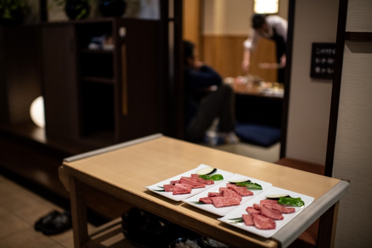 This picture taken on Oct. 13, 2018 shows wagyu beef being served at a restaurant in Takayama. In a lush field in the heart of the Japanese mountains, a herd of glossy black cows roam happily -- prime examples of the area's Hida brand of wagyu beef.