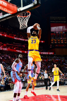 Triple for James but Lakers stumble; Warriors roll on