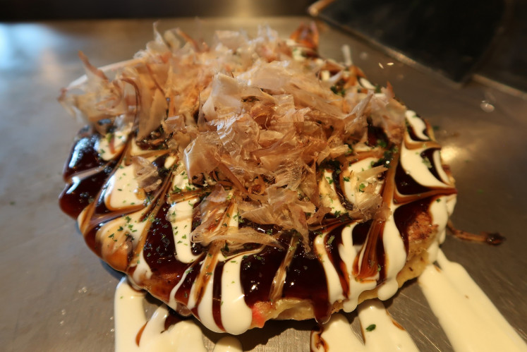 Chibo’s ‘okonomiyaki’ is chock-full with ingredients, including cabbage, squid and sliced beef.
