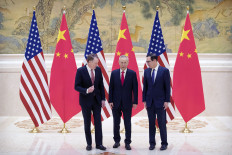 United States Trade Representative Robert Lighthizer (left), Chinese Vice Premier and lead trade negotiator Liu He (center) and US Treasury Secretary Steven Mnuchin talk before the opening session of trade negotiations at the Diaoyutai State Guesthouse in Beijing on Thursday. US and Chinese negotiators kicked off two days of official trade talks in Beijing as the world’s top two economies tried to patch up their festering economic dispute.