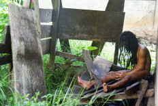Aleksius Dugis, a 31-year-old man with mental illness, is shackled in a makeshift shed outside the kitchen of his parents’ house in Zola village of Kota Komba district, East Manggarai regency, East Nusa Tenggara, in this file photo from February 2019.