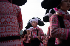 Girls sport their ancestors' hair for Lunar New year in China