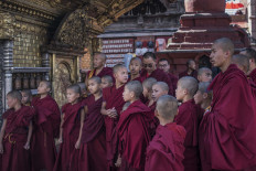 Monks pray at Swayambhunath Temple. JP/Rosa Panggabean
